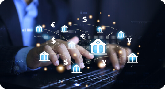 Hands typing with global currency and banking icons showing financial connectivity.